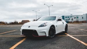 Blog 12 White sports coupe parked in an open lot