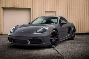 Blog 3 Grey Porsche Cayman parked outside a roller door