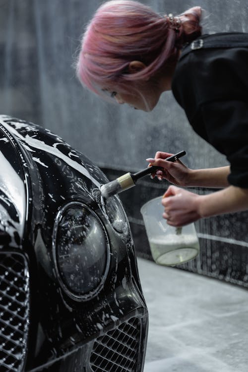 Mobile car detailing service washing vehicle at home in Bluffton SC - Lux Detailer mobile vs shop detailing comparison