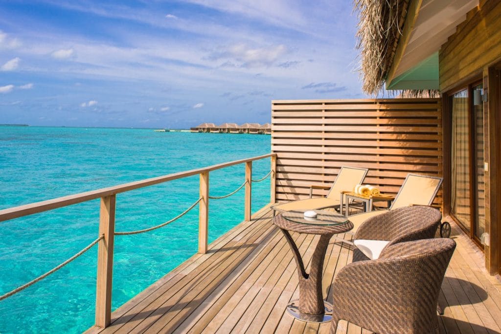 RV Detailing: Everything You Need to Know Before Your Next Road Trip 6 Waterfront resort deck with lounge chairs above turquoise water