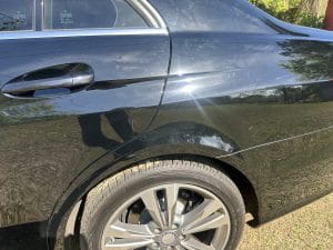 Blog 5 Black car door and alloy wheel after detailing
