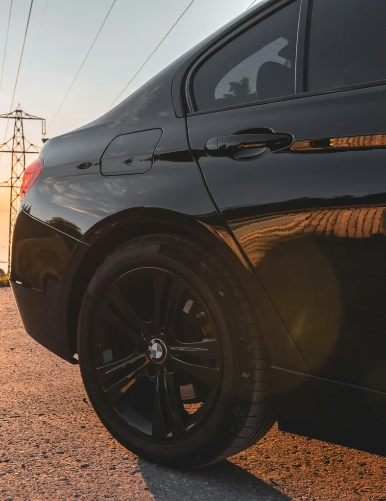 Detailed black car shining at sunset